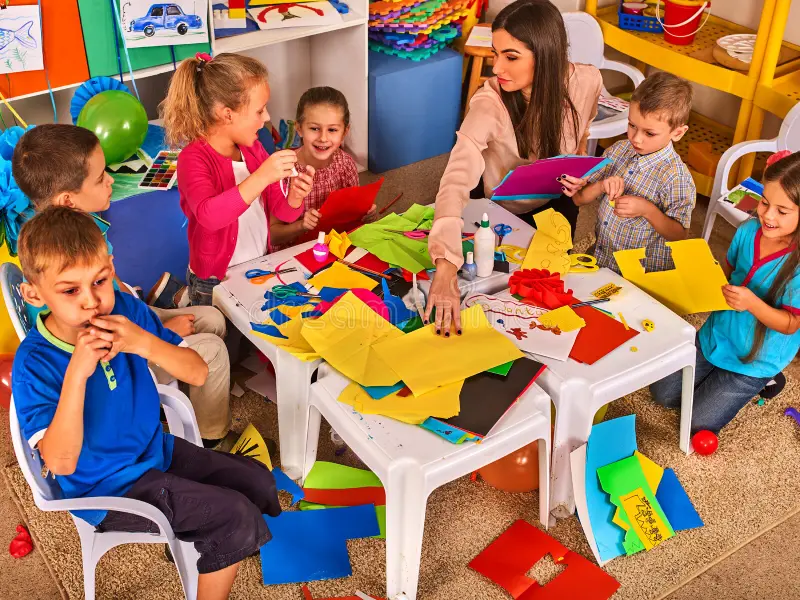 Children painting and building during a creative activity